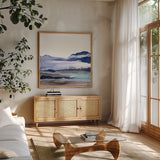 Bluescape I by Chris Paschke. Shown in a natural wood frame in a cozy modern living room. Available as an archival giclee rolled canvas, fine art paper, or poster print. SKU 66745a.
