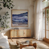 Bluescape III by Chris Paschke. Shown in a natural wood frame in a cozy modern living room. Available as an archival giclee rolled canvas, fine art paper, or poster print. SKU 66747a.