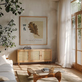 Bronze Leaf II Sacred Dreams by Chris Paschke. Shown in a natural wood frame in a cozy modern living room. Available as an archival giclee rolled canvas, fine art paper, or poster print. SKU 36625a.