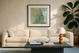 Buddha Bright I by Chris Paschke. Displayed in a glass frame with matte in a clean modern living room. Available as an archival giclee rolled canvas, fine art paper, or poster print. SKU 48022a.