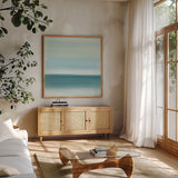 Coastal Abstraction I by Chris Paschke. Shown in a natural wood frame in a cozy modern living room. Available as an archival giclee rolled canvas, fine art paper, or poster print. SKU 65464a.
