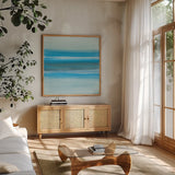 Coastal Abstraction III by Chris Paschke. Shown in a natural wood frame in a cozy modern living room. Available as an archival giclee rolled canvas, fine art paper, or poster print. SKU 65470a.