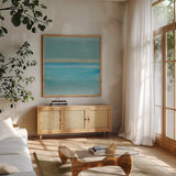 Coastal Abstraction VI by Chris Paschke. Shown in a natural wood frame in a cozy modern living room. Available as an archival giclee rolled canvas, fine art paper, or poster print. SKU 65473a.