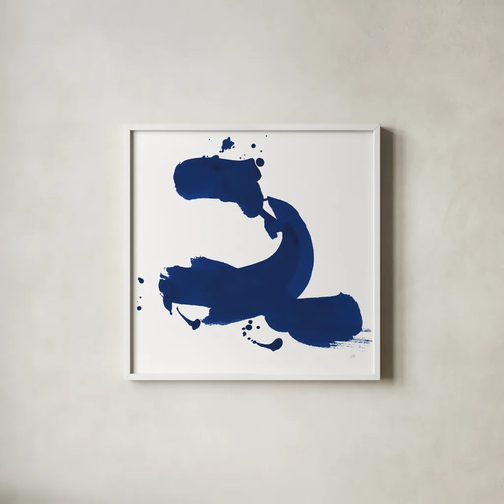 Cobalt Ink Drops II by Chris Paschke. Shown in a crisp white glass frame for a clean and minimalist style. Available as an archival giclee rolled canvas, fine art paper, or poster print. SKU 67369a.