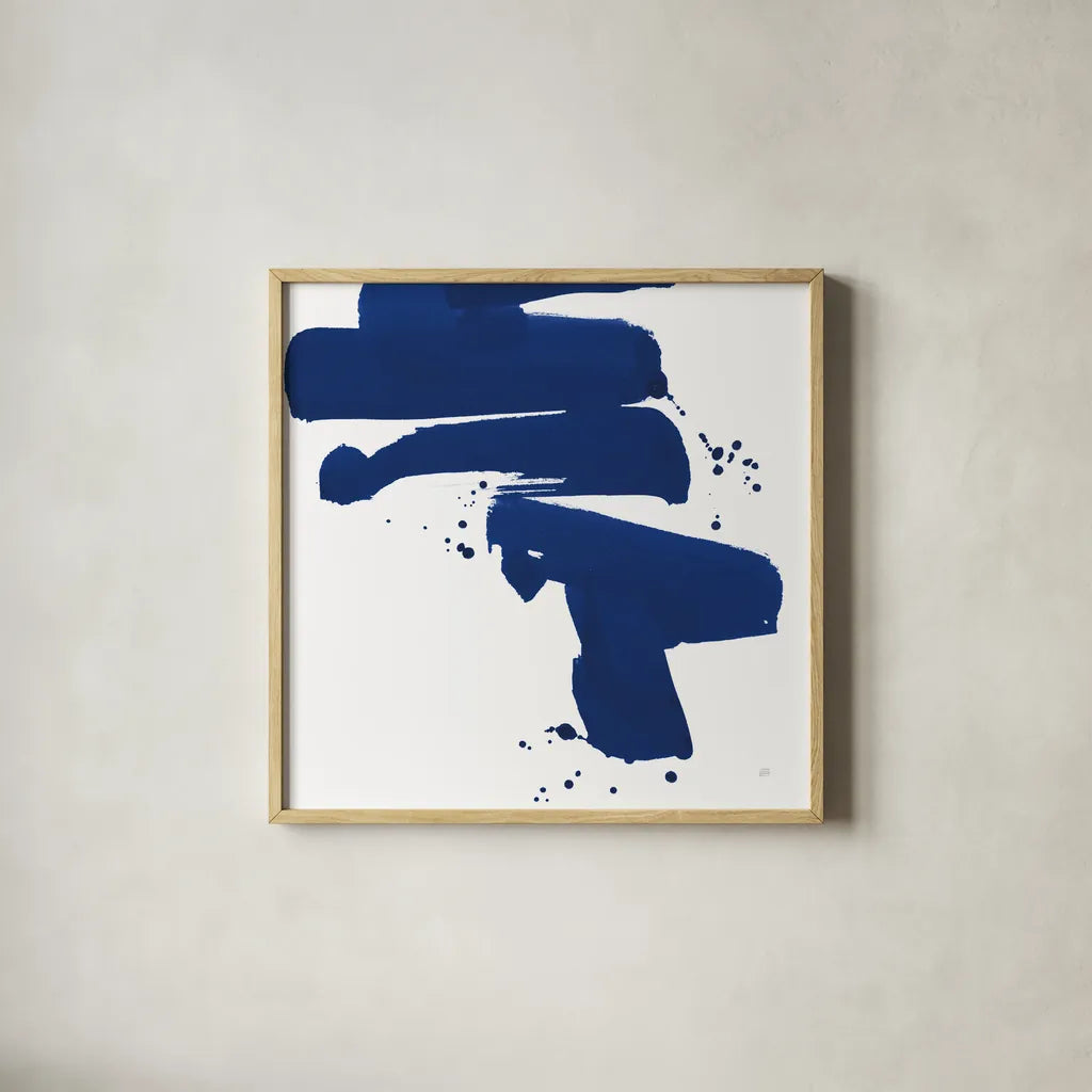 Cobalt Ink Drops IV by Chris Paschke. Shown in a natural wood glass frame for a timeless modern aesthetic. Available as an archival giclee rolled canvas, fine art paper, or poster print. SKU 67371a.