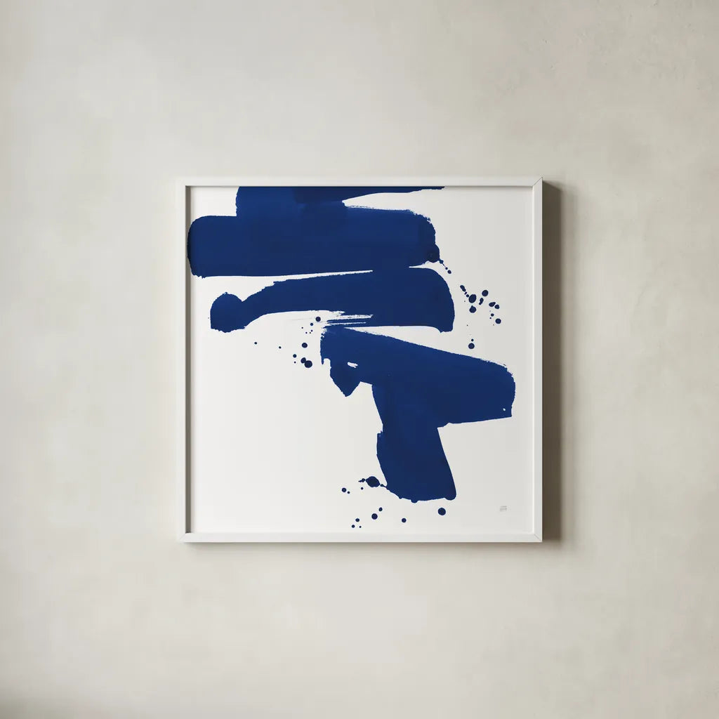 Cobalt Ink Drops IV by Chris Paschke. Shown in a crisp white glass frame for a clean and minimalist style. Available as an archival giclee rolled canvas, fine art paper, or poster print. SKU 67371a.
