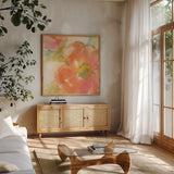 Coral Poppy I by Chris Paschke. Shown in a natural wood frame in a cozy modern living room. Available as an archival giclee rolled canvas, fine art paper, or poster print. SKU 50157a.