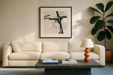Creamy Neutral II by Chris Paschke. Displayed in a glass frame with matte in a clean modern living room. Available as an archival giclee rolled canvas, fine art paper, or poster print. SKU 27923a.