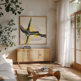 Creamy Yellow I by Chris Paschke. Shown in a natural wood frame in a cozy modern living room. Available as an archival giclee rolled canvas, fine art paper, or poster print. SKU 26812a.