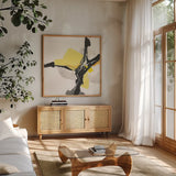 Creamy Yellow III by Chris Paschke. Shown in a natural wood frame in a cozy modern living room. Available as an archival giclee rolled canvas, fine art paper, or poster print. SKU 26814a.