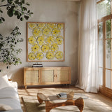 Cut Lemons IV by Chris Paschke. Shown in a natural wood frame in a cozy modern living room. Available as an archival giclee rolled canvas, fine art paper, or poster print. SKU 66887a.