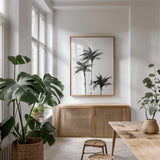 Dark Palms II by Chris Paschke. shown as a print in a natural wood frame in a dining room. Available as a archival giclee rolled canvas, fine art paper, or poster print. SKU 78875h.