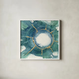 Dharma Wheel I by Chris Paschke. Shown in a crisp white glass frame for a clean and minimalist style. Available as an archival giclee rolled canvas, fine art paper, or poster print. SKU 48026a.