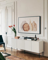 Earthy Neutral Vases IV by Chris Paschke. shown as a framed stretched canvas in a living room above a console. Available as a archival giclee rolled canvas, fine art paper, or poster print. SKU 77194i.