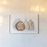 Earthy Neutral Vases IV by Chris Paschke. shown as a paper print in a white frame. Available as a archival giclee rolled canvas, fine art paper, or poster print. SKU 77194i.
