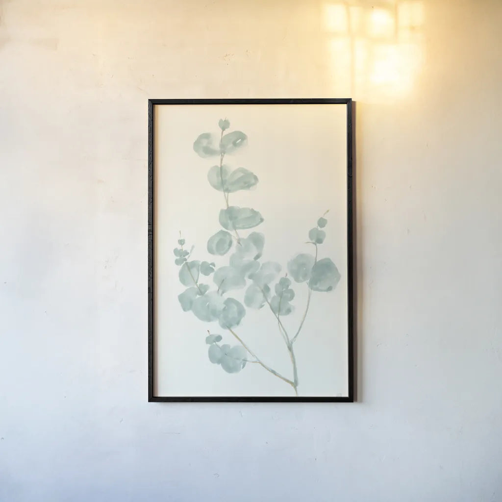Eucalyptus Branch I by Chris Paschke. shown as a paper print in a black flame. Available as a archival giclee rolled canvas, fine art paper, or poster print. SKU 55063h.