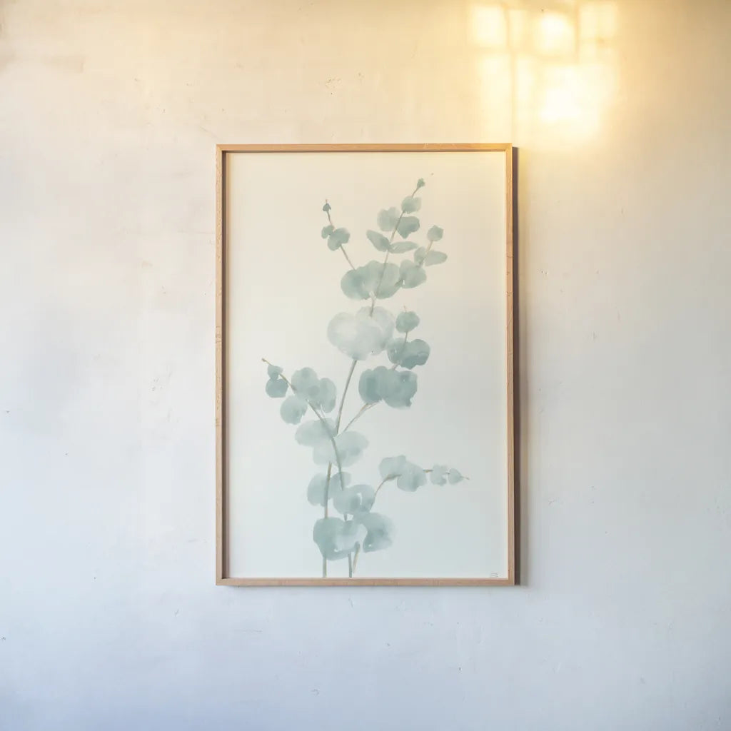 Eucalyptus Branch II by Chris Paschke. shown as a paper print in a natural frame. Available as a archival giclee rolled canvas, fine art paper, or poster print. SKU 55064h.
