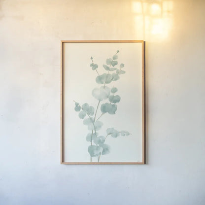 Eucalyptus Branch II by Chris Paschke. shown as a paper print in a natural frame. Available as a archival giclee rolled canvas, fine art paper, or poster print. SKU 55064h.
