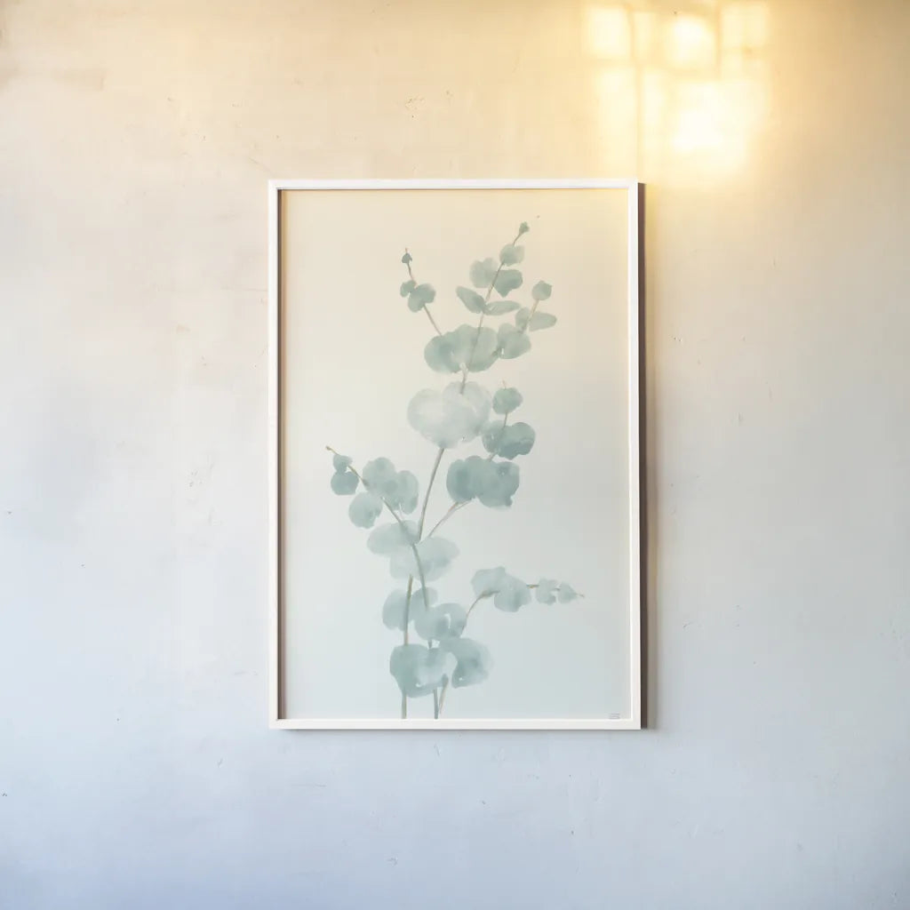 Eucalyptus Branch II by Chris Paschke. shown as a paper print in a white frame. Available as a archival giclee rolled canvas, fine art paper, or poster print. SKU 55064h.