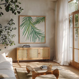 Ferns IV Square by Chris Paschke. Shown in a natural wood frame in a cozy modern living room. Available as an archival giclee rolled canvas, fine art paper, or poster print. SKU 24946a.