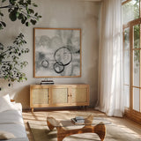 Full Circle II Gray by Chris Paschke. Shown in a natural wood frame in a cozy modern living room. Available as an archival giclee rolled canvas, fine art paper, or poster print. SKU 22779a.