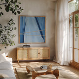 Geometrics IV by Chris Paschke. Shown in a natural wood frame in a cozy modern living room. Available as an archival giclee rolled canvas, fine art paper, or poster print. SKU 68183a.