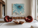 Gerbera Blue III by Chris Paschke. Shown as extra-large giant wall art in a modern living room. Available as an archival giclee rolled canvas, fine art paper, or poster print. SKU 11092a.