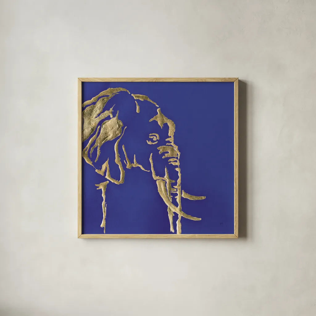 Gilded Elephant Indigo by Chris Paschke. Shown in a natural wood glass frame for a timeless modern aesthetic. Available as an archival giclee rolled canvas, fine art paper, or poster print. SKU 41916a.