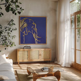 Gilded Elephant Indigo by Chris Paschke. Shown in a natural wood frame in a cozy modern living room. Available as an archival giclee rolled canvas, fine art paper, or poster print. SKU 41916a.