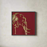 Gilded Elephant on Red by Chris Paschke. Shown in a sleek black glass frame for a contemporary gallery look. Available as an archival giclee rolled canvas, fine art paper, or poster print. SKU 41921a.