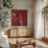 Gilded Elephant on Red by Chris Paschke. Shown in a natural wood frame in a cozy modern living room. Available as an archival giclee rolled canvas, fine art paper, or poster print. SKU 41921a.