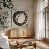 Gilded Enso I by Chris Paschke. Shown in a natural wood frame in a cozy modern living room. Available as an archival giclee rolled canvas, fine art paper, or poster print. SKU 34701a.