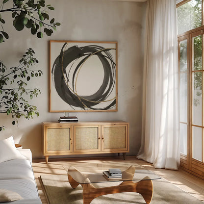 Gilded Enso I by Chris Paschke. Shown in a natural wood frame in a cozy modern living room. Available as an archival giclee rolled canvas, fine art paper, or poster print. SKU 34701a.