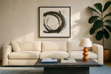Gilded Enso II by Chris Paschke. Displayed in a glass frame with matte in a clean modern living room. Available as an archival giclee rolled canvas, fine art paper, or poster print. SKU 34702a.