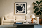 Gilded Enso II BW by Chris Paschke. Displayed in a glass frame with matte in a clean modern living room. Available as an archival giclee rolled canvas, fine art paper, or poster print. SKU 54817a.