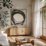 Gilded Enso III by Chris Paschke. Shown in a natural wood frame in a cozy modern living room. Available as an archival giclee rolled canvas, fine art paper, or poster print. SKU 34703a.