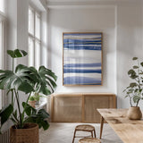 Gilded Grey III Indigo and White by Chris Paschke. shown as a print in a natural wood frame in a dining room. Available as a archival giclee rolled canvas, fine art paper, or poster print. SKU 27104h.