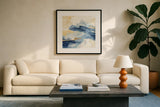 Gilded Indigo I by Chris Paschke. Displayed in a glass frame with matte in a clean modern living room. Available as an archival giclee rolled canvas, fine art paper, or poster print. SKU 25553a.