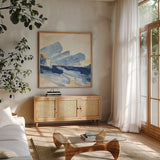 Gilded Indigo II by Chris Paschke. Shown in a natural wood frame in a cozy modern living room. Available as an archival giclee rolled canvas, fine art paper, or poster print. SKU 25554a.
