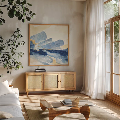 Gilded Indigo II by Chris Paschke. Shown in a natural wood frame in a cozy modern living room. Available as an archival giclee rolled canvas, fine art paper, or poster print. SKU 25554a.