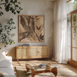 Gilded Leaf Collage II by Chris Paschke. Shown in a natural wood frame in a cozy modern living room. Available as an archival giclee rolled canvas, fine art paper, or poster print. SKU 96188a.