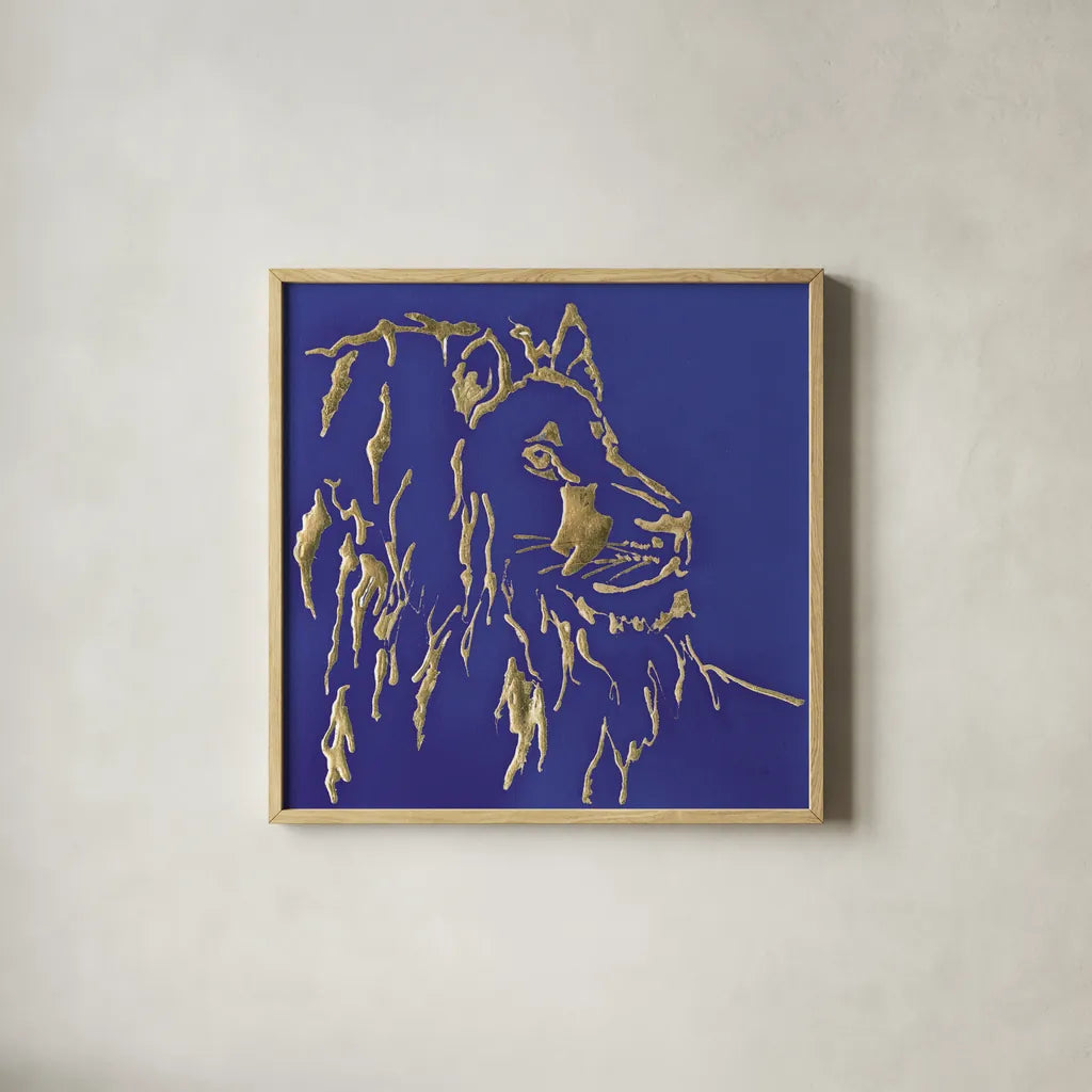 Gilded Lion Indigo by Chris Paschke. Shown in a natural wood glass frame for a timeless modern aesthetic. Available as an archival giclee rolled canvas, fine art paper, or poster print. SKU 41917a.
