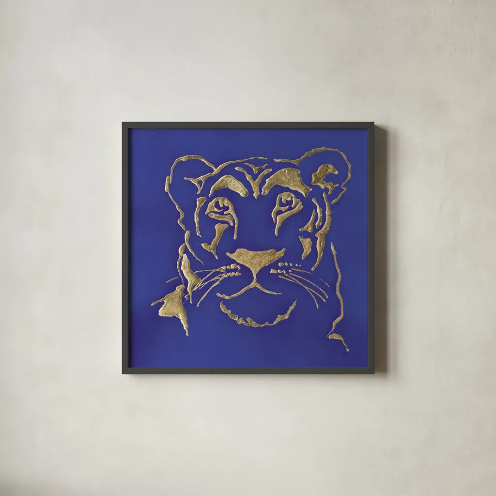 Gilded Lioness Indigo by Chris Paschke. Shown in a sleek black glass frame for a contemporary gallery look. Available as an archival giclee rolled canvas, fine art paper, or poster print. SKU 41918a.