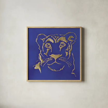 Gilded Lioness Indigo by Chris Paschke. Shown in a natural wood glass frame for a timeless modern aesthetic. Available as an archival giclee rolled canvas, fine art paper, or poster print. SKU 41918a.