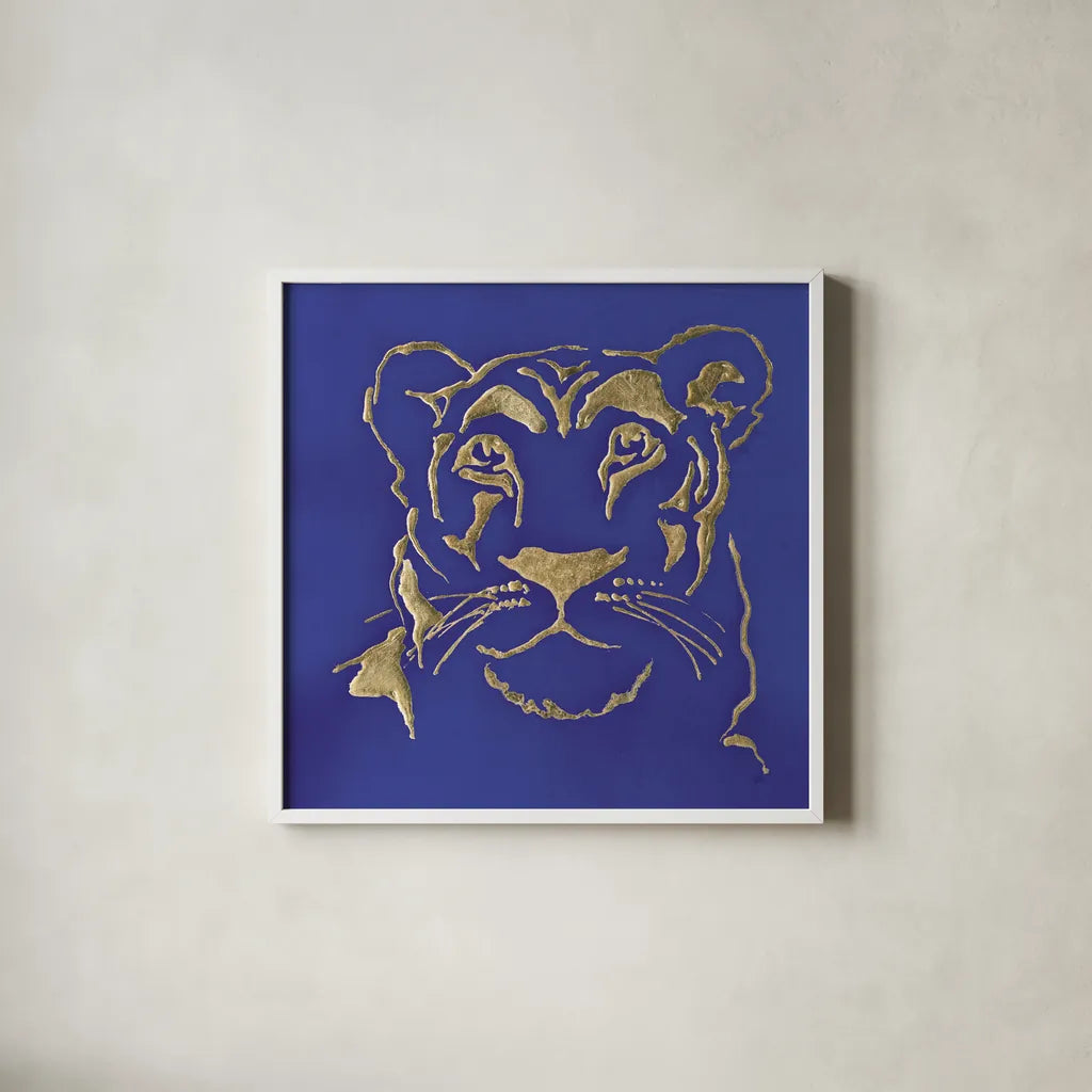 Gilded Lioness Indigo by Chris Paschke. Shown in a crisp white glass frame for a clean and minimalist style. Available as an archival giclee rolled canvas, fine art paper, or poster print. SKU 41918a.