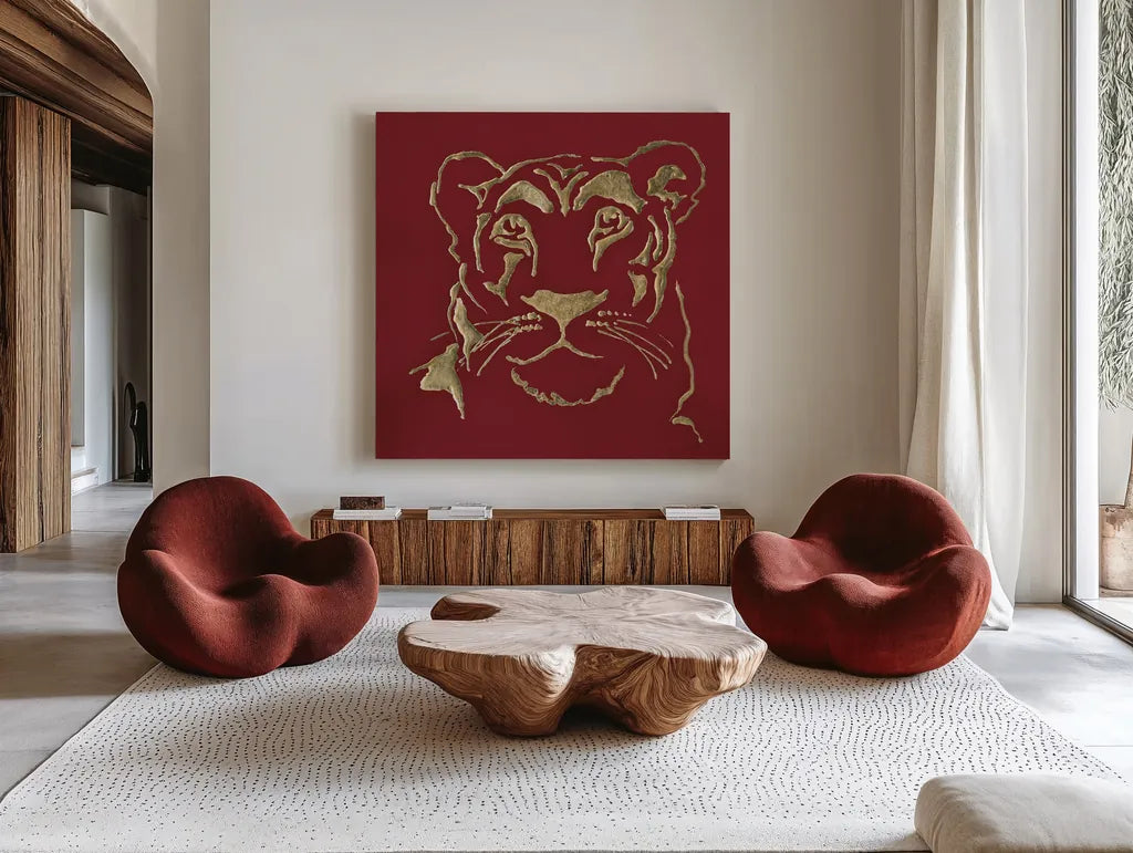Gilded Lioness on Red by Chris Paschke. Shown as extra-large giant wall art in a modern living room. Available as an archival giclee rolled canvas, fine art paper, or poster print. SKU 41923a.