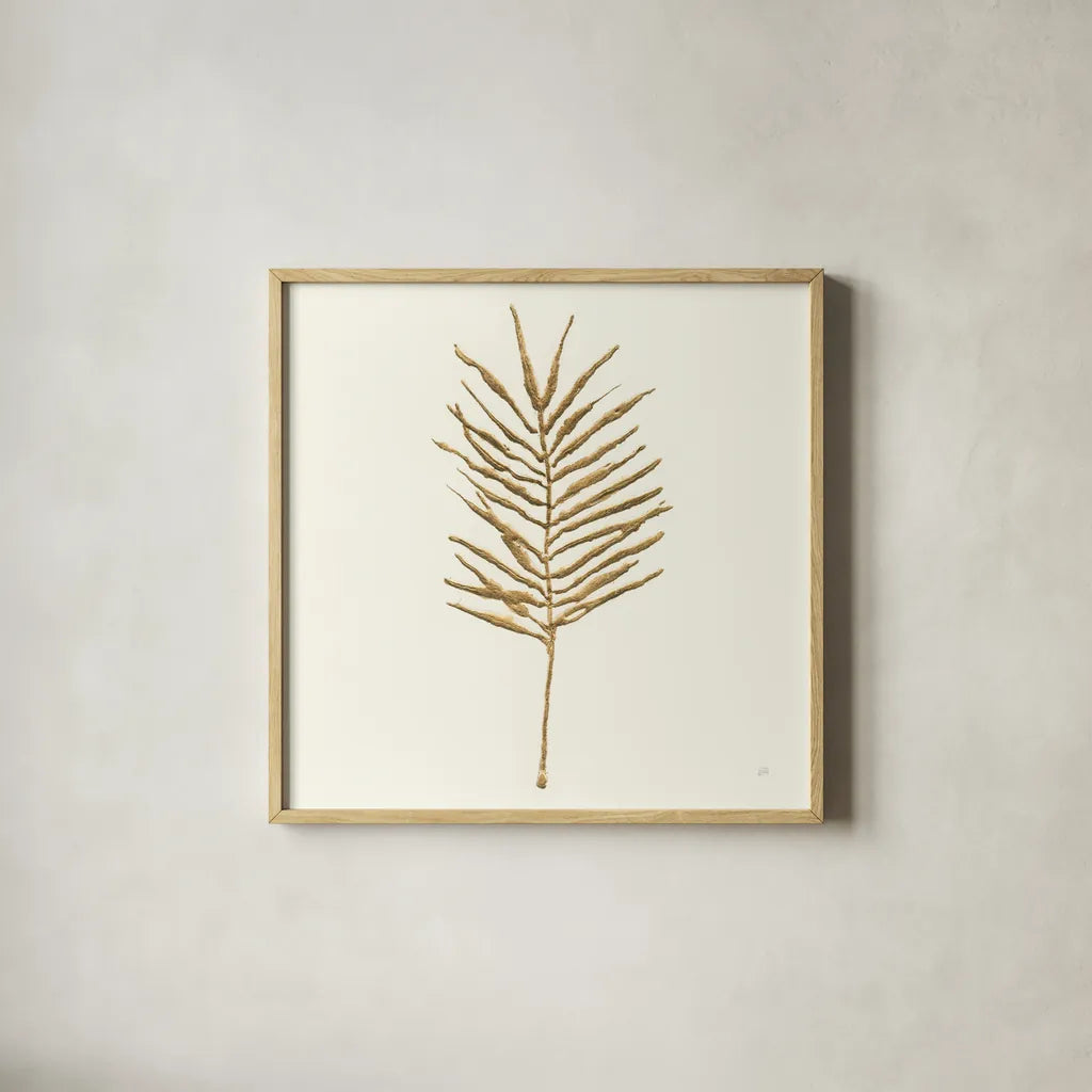 Gilded Palm VI by Chris Paschke. Shown in a natural wood glass frame for a timeless modern aesthetic. Available as an archival giclee rolled canvas, fine art paper, or poster print. SKU 57204a.