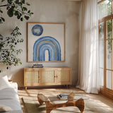 Gilded Rainbow III by Chris Paschke. Shown in a natural wood frame in a cozy modern living room. Available as an archival giclee rolled canvas, fine art paper, or poster print. SKU 68187a.