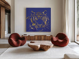 Gilded Tiger Indigo by Chris Paschke. Shown as extra-large giant wall art in a modern living room. Available as an archival giclee rolled canvas, fine art paper, or poster print. SKU 41919a.