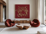 Gilded Tiger on Red by Chris Paschke. Shown as extra-large giant wall art in a modern living room. Available as an archival giclee rolled canvas, fine art paper, or poster print. SKU 41924a.